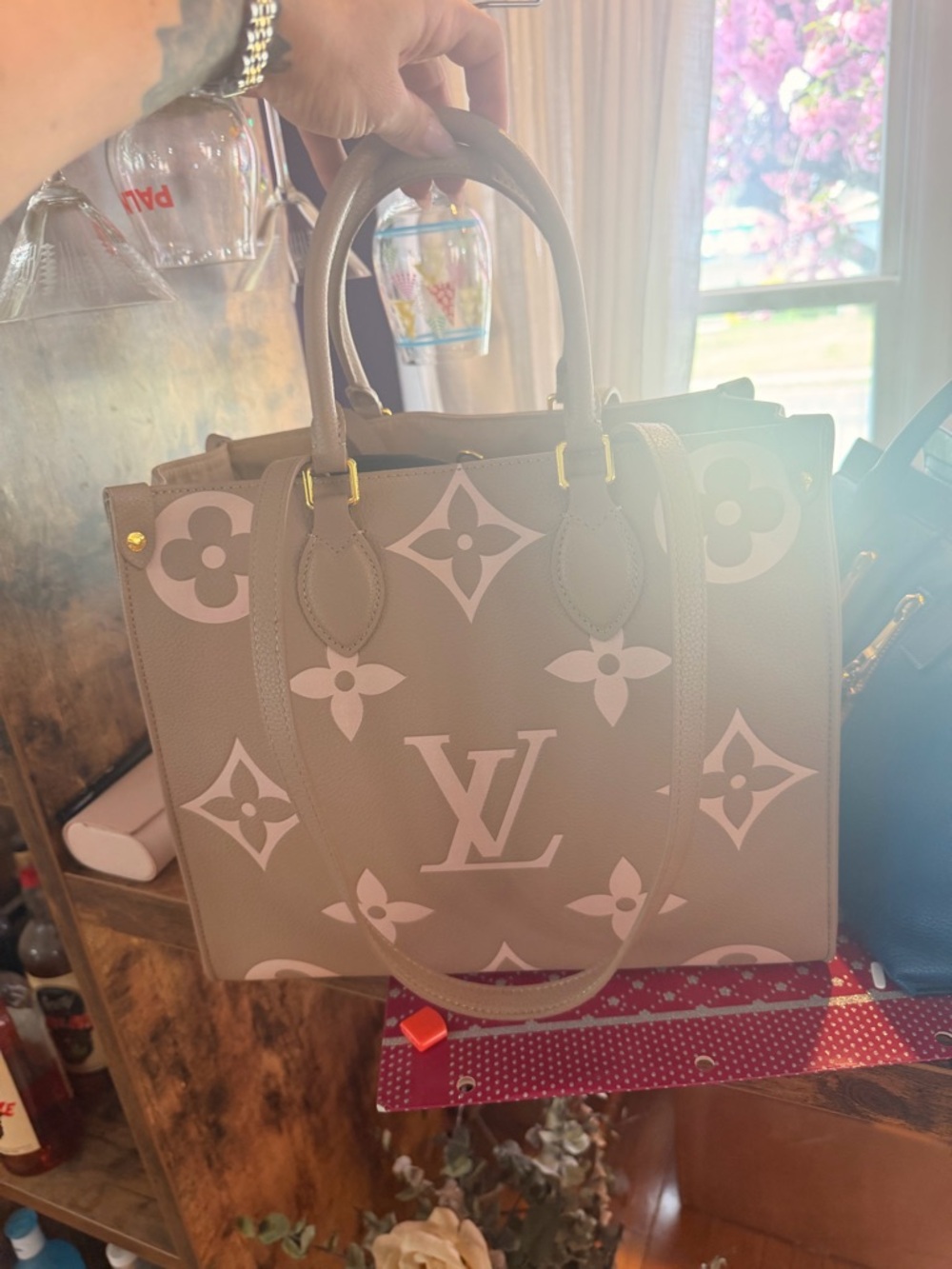 Louis Vuitton ON THE GO MM! Beige Satchel with Pink Monogram Accents.